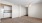 a room with a window and ceiling fan